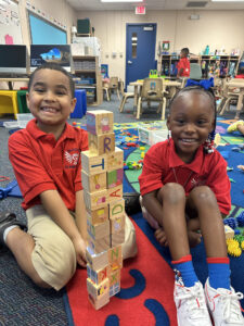 two children playing with blocks