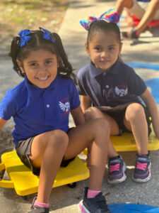 two girls playing outside